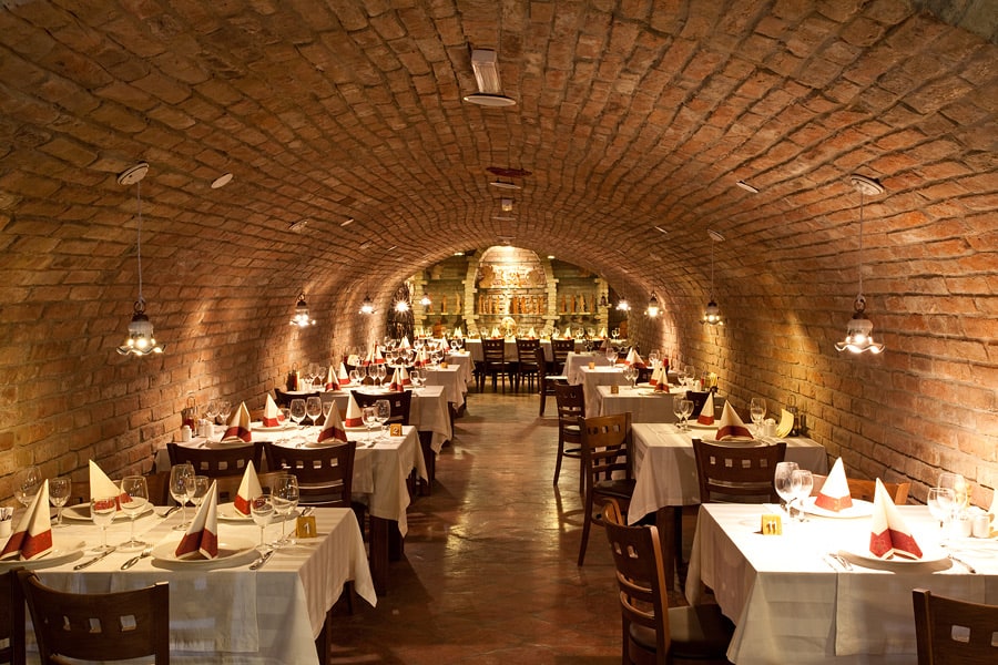 Josić Winery indoor restaurant with tables set for dine