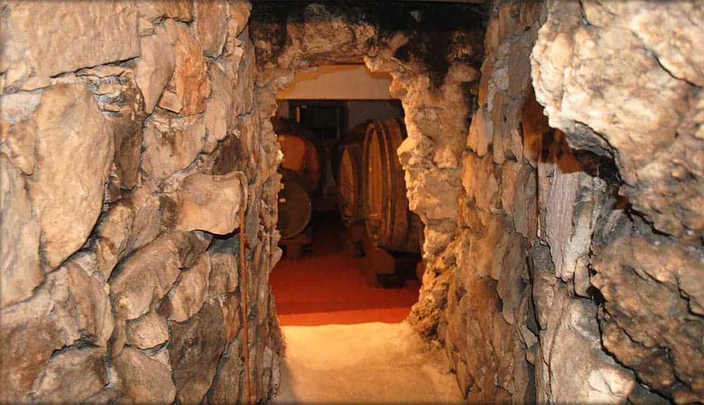 Indoor entrace to a cave like Miloš Winery wine cellar