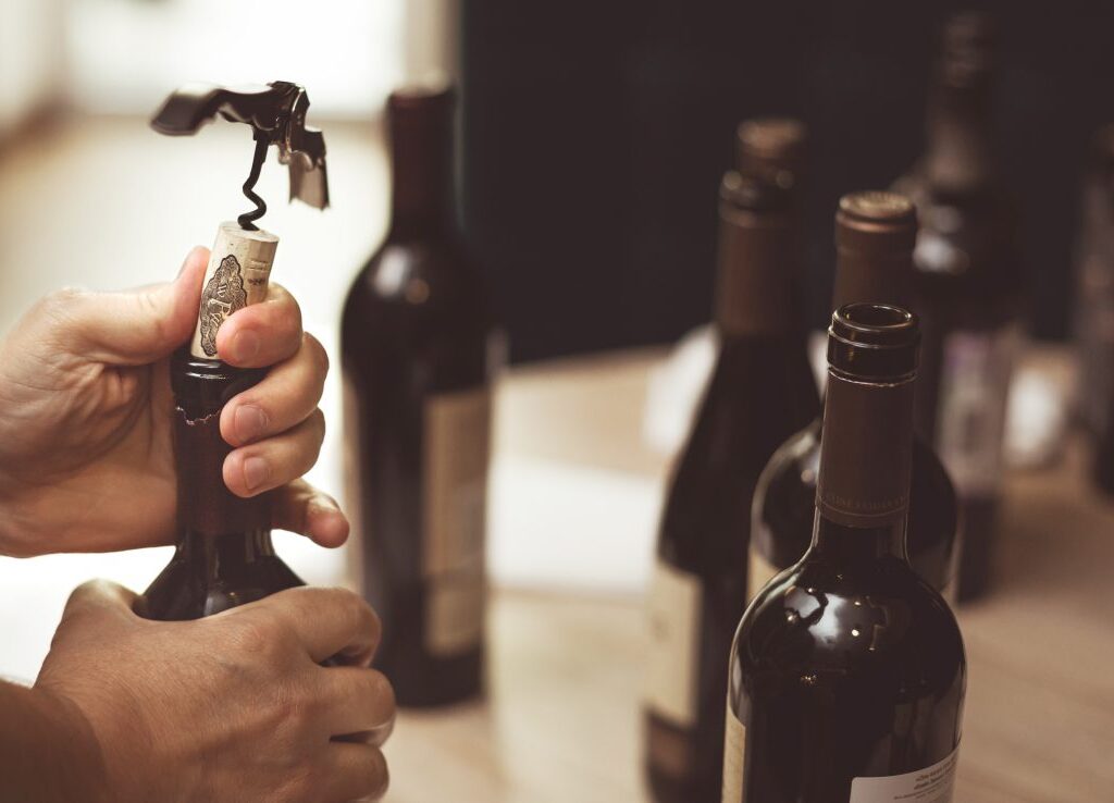featured image of opening a wine bottle with waiters corkscrew