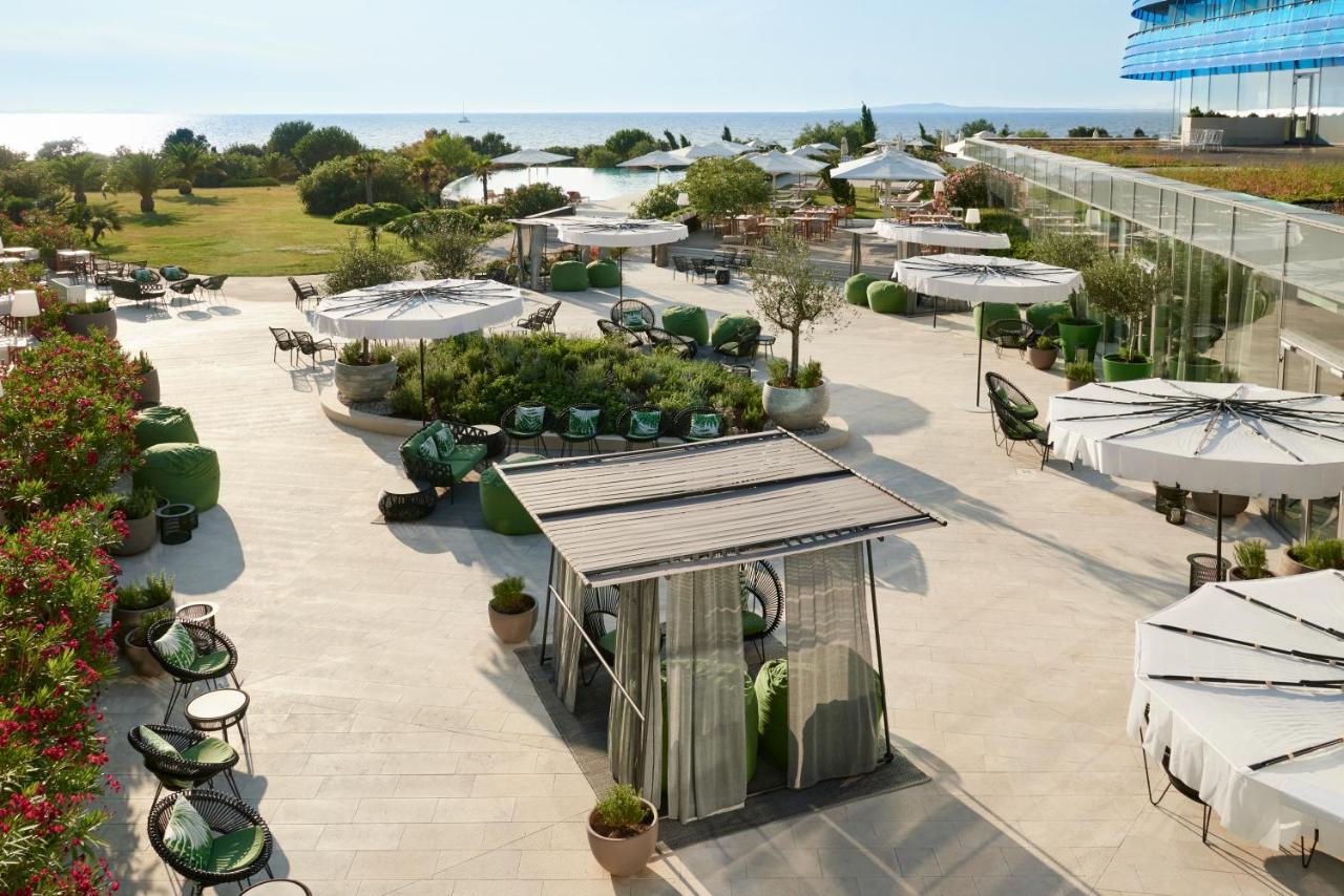 Image shows beach bar with a sea view of Falkensteiner hotel