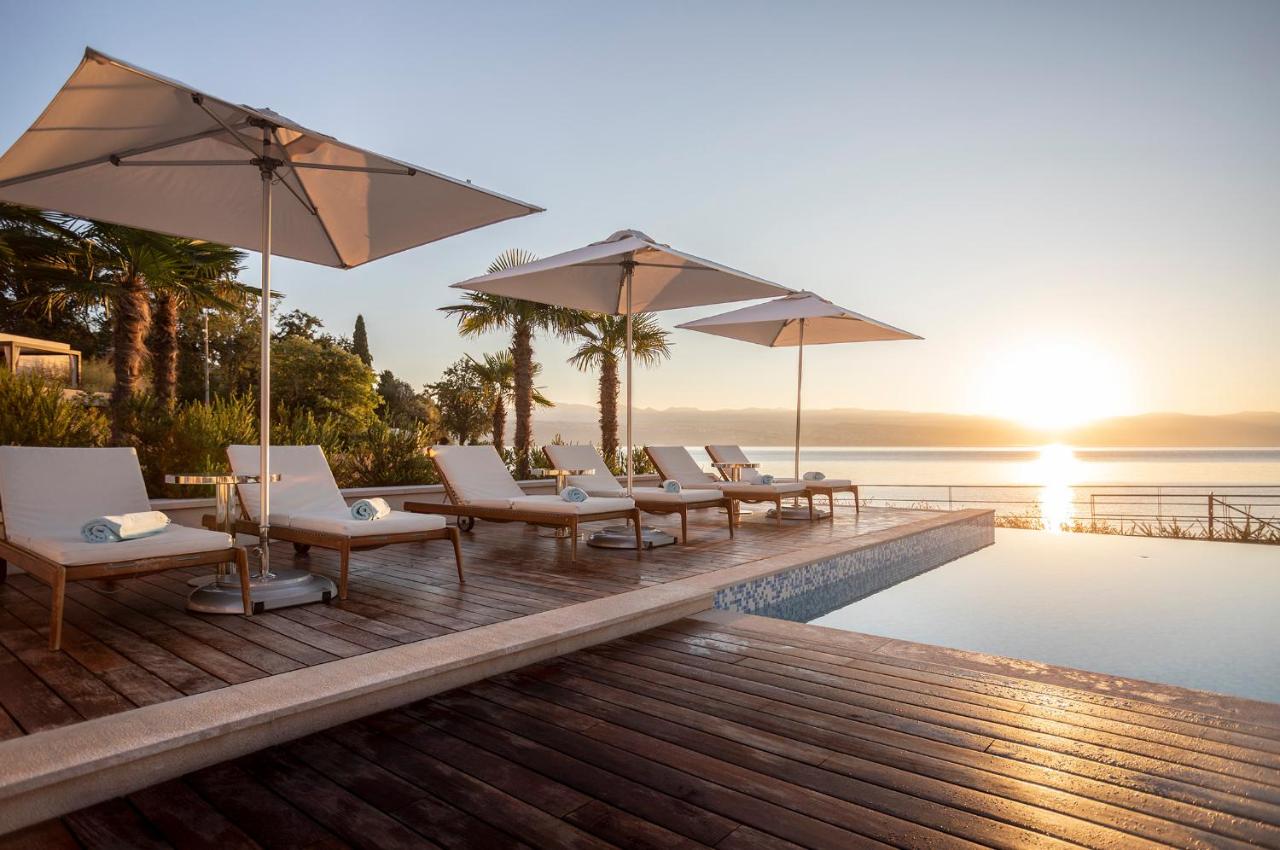 Image shows scenic sunrise and outdoor pool in Ikador hotel