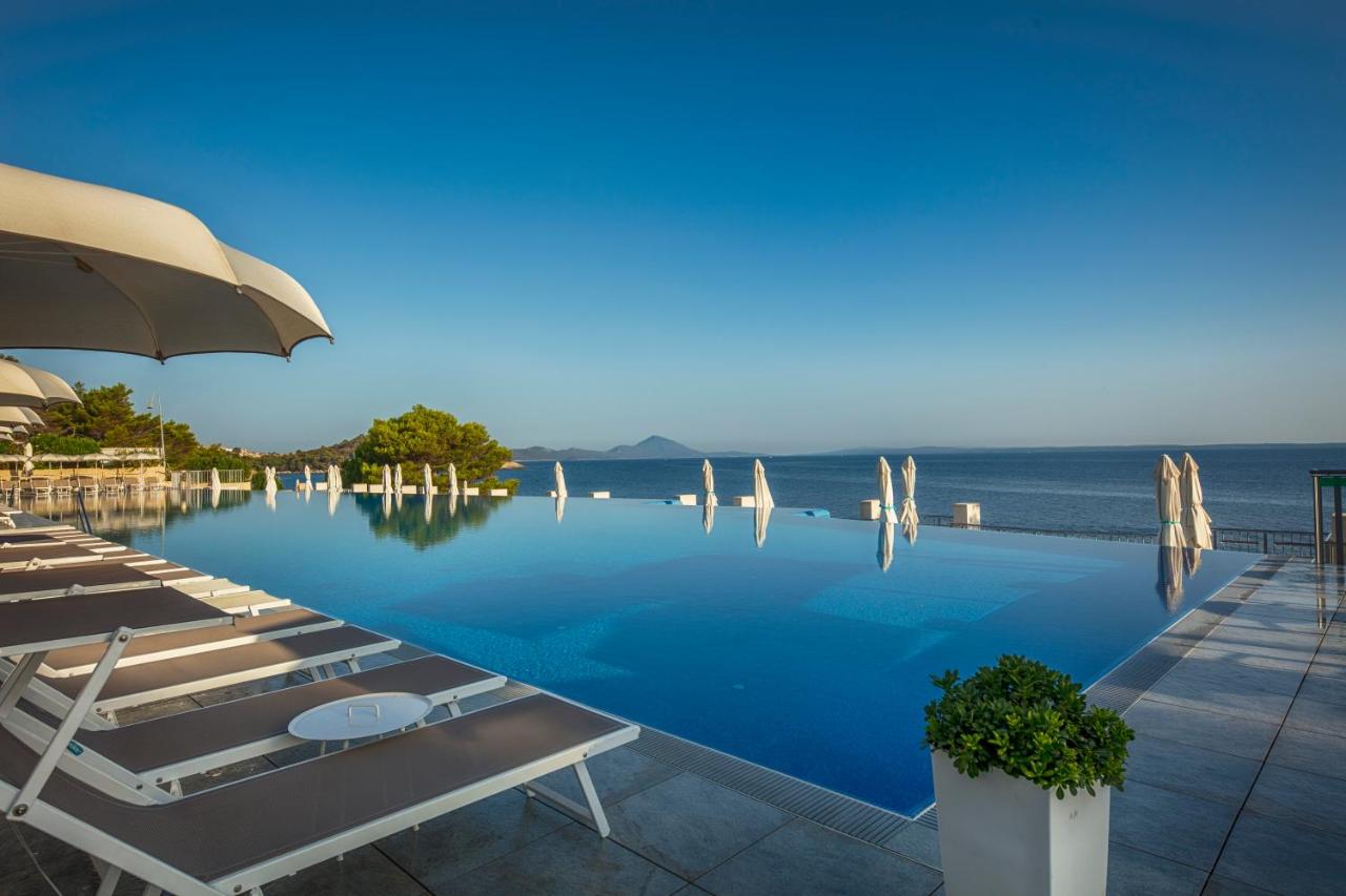 Image shows outdoor pool with scenic sea view at Vitality Hotel Punta