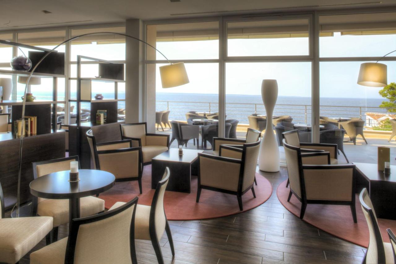 Image shows interior design of a bar lobby at Vitality Hotel Punta