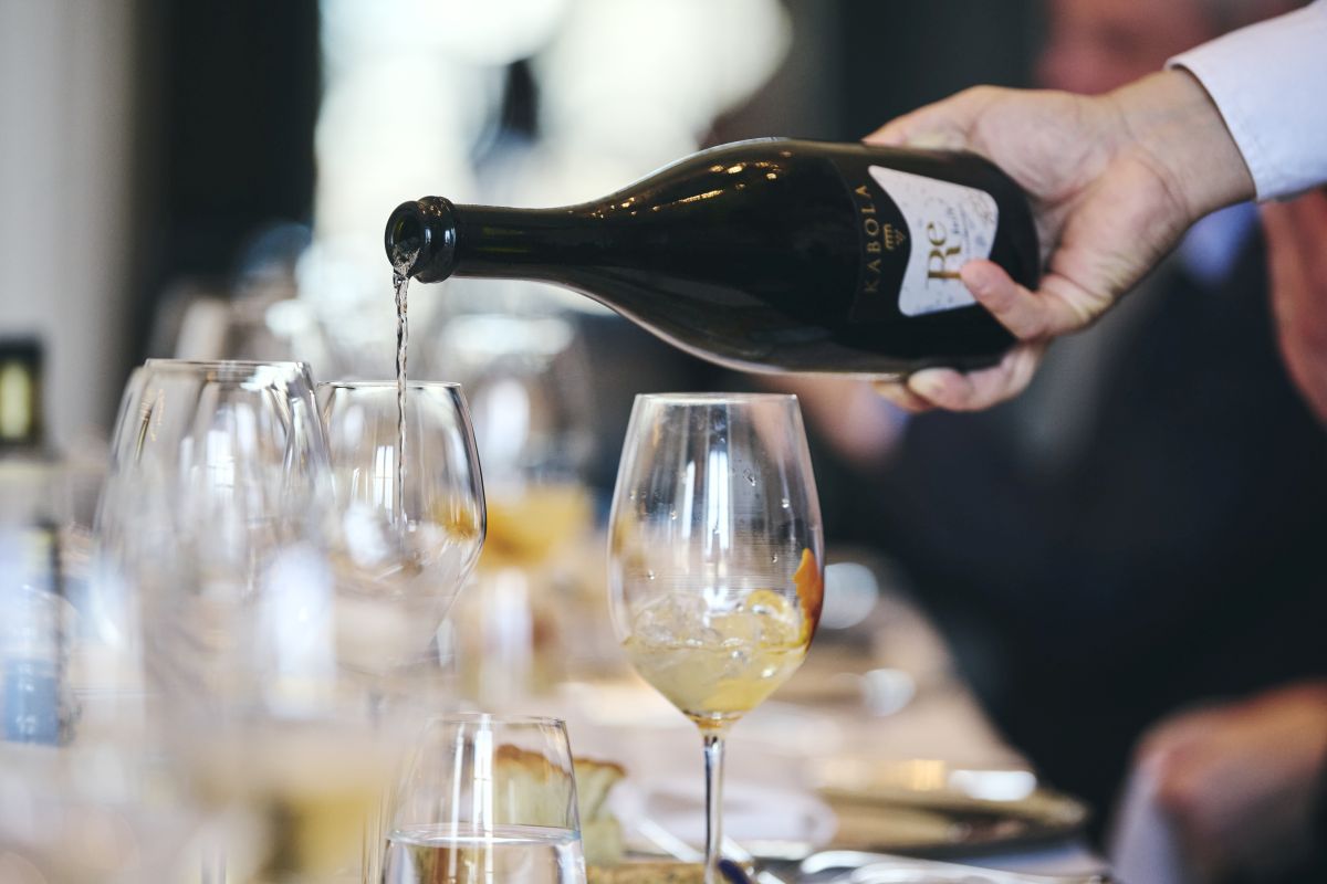 Image of waiter pouring Kabola sparkling Re wine