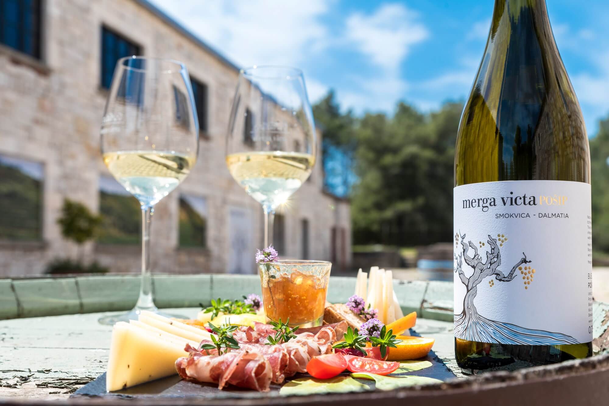 Image of a food and wine served on the outside terrace of Black Island Winery