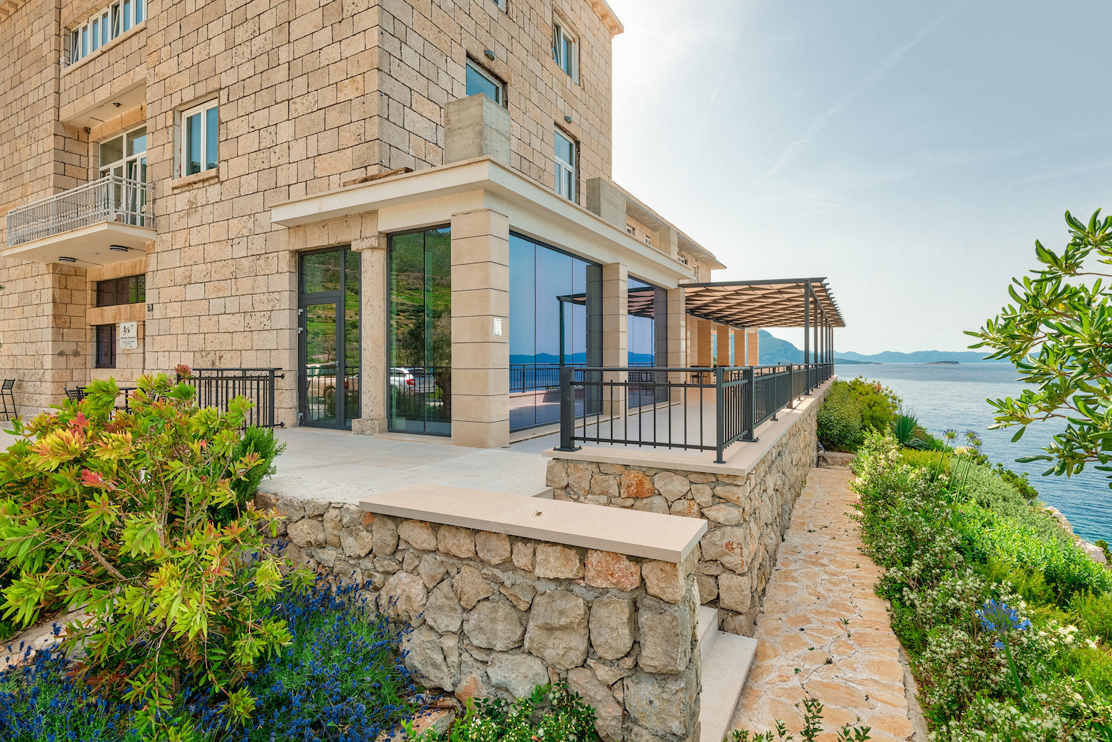 Image of exterior design of a Grgić Winery overlooking the Adriatic sea