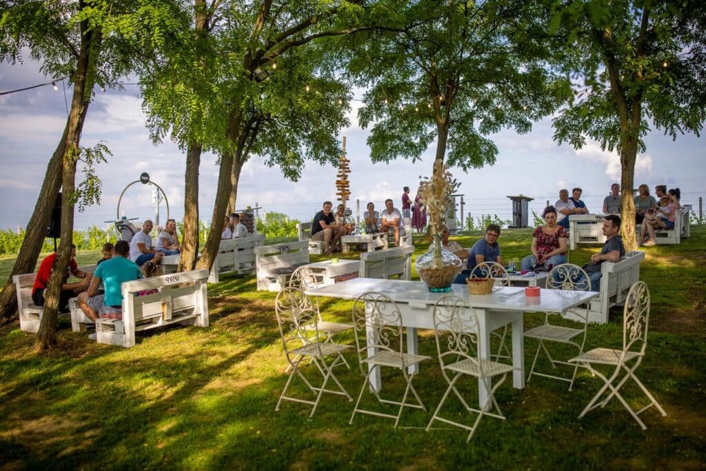 Image of tables and wine tasting held in the vineyards of Štampar Winery