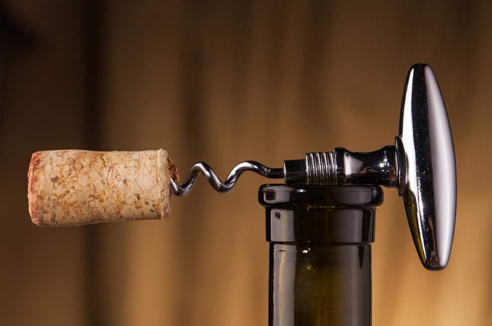 Image of a wine opener with a cork on a bottle of wine