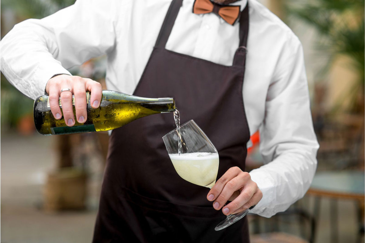 Prosecco-Method---How-is-Charmat-Sparkling-wine-made-waiter-pour-sparkling-wine