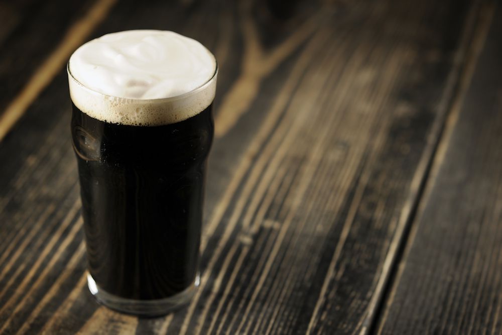 Image of a stout beer on a wooden table