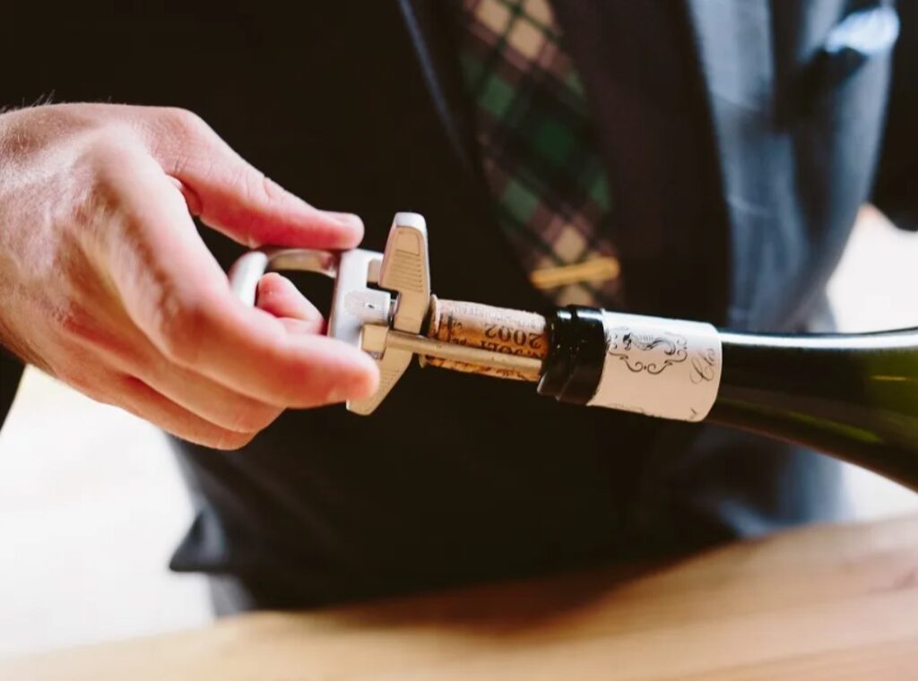 Image of opening a wine bottle with Durand bottle opener