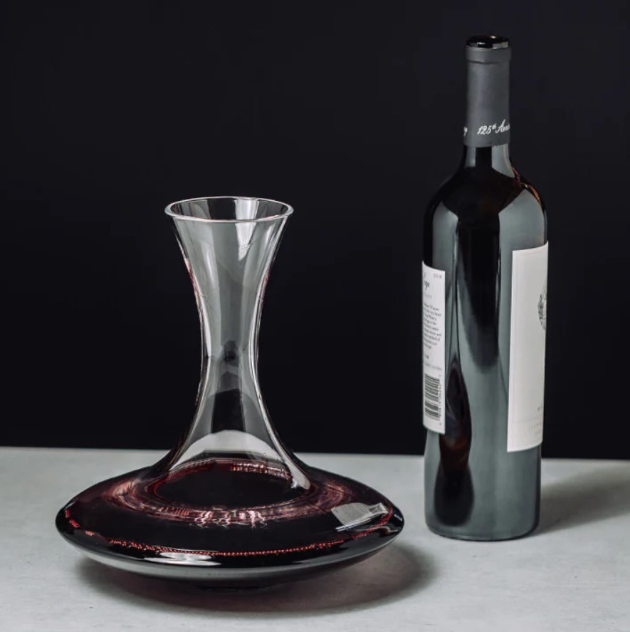 Image of Riedel Ultra Decanter on a table with a bottle of wine