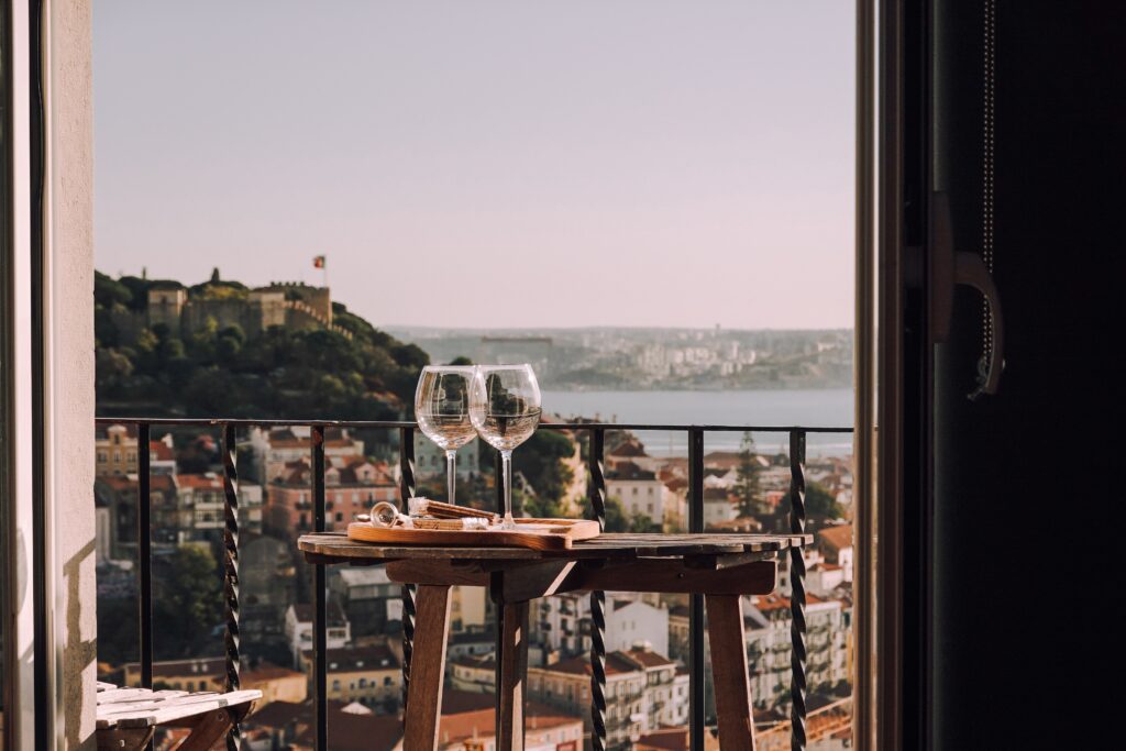 Image of wine glasses on a table with a panoramic view